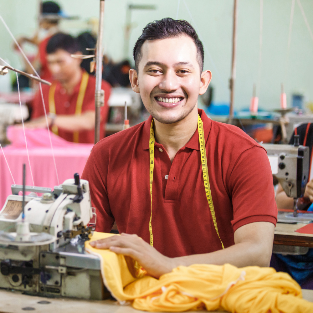 man sewing clothes