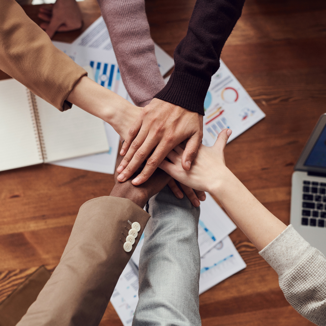 hands in a circle for teamwork